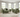 Green Penny 2 seater fabric sofa with matching armchair in bright living room with large windows and beige rug