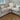 Beige Roxy Night 1.5 Corner 1.5 Modular Fabric Sofa with cushions in bright living room corner on wooden floor