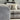 Grey fabric Roxy Night 3 corner sofa with 1.5 terminal footstool in a modern living room setting
