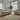 Roxy Night 4 Seater Sofa set in beige fabric with cushioned seats and armrests in a bright modern living room.