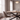 Sadina dining set low-angle view of a biscuit chair at the table end with bowl and candlesticks on the oak top