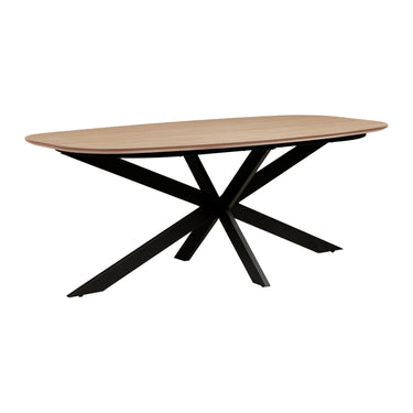 Sadina 200cm oval dining table in oak effect with black crossed metal starburst base, angled view on white