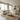 Cream Archie corner sofa on a jute rug in a bright open-plan living room with the kitchen behind
