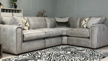 Roxy Night 3 corner 1.5 fabric sofa in grey with cushions, modern design, placed in a living room setting with patterned rug.