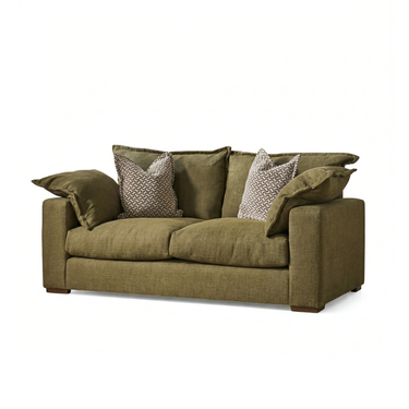 Two-seater olive green fabric sofa with loose cushions and two patterned throw pillows on white background