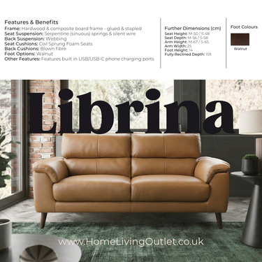 Tan leather Librina armchair with padded cushions and wooden legs in a contemporary room setting