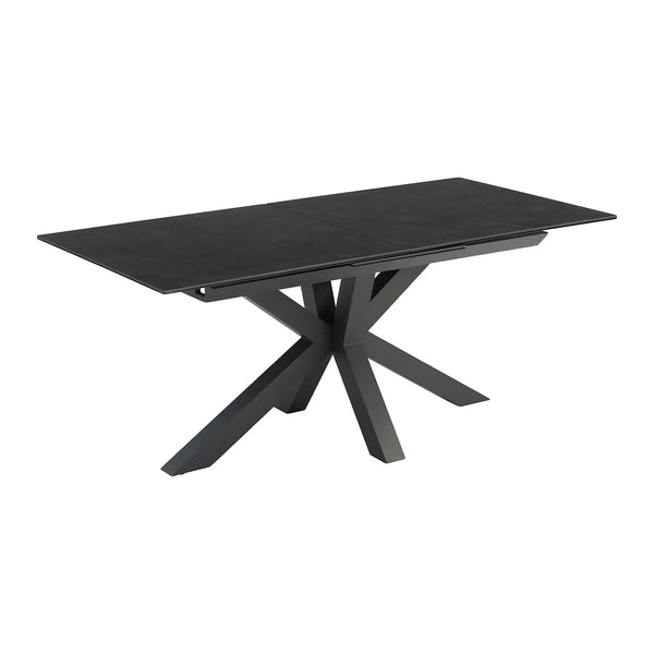 Mars extending dining table with dark grey ceramic top and black spider base, angled view on white background