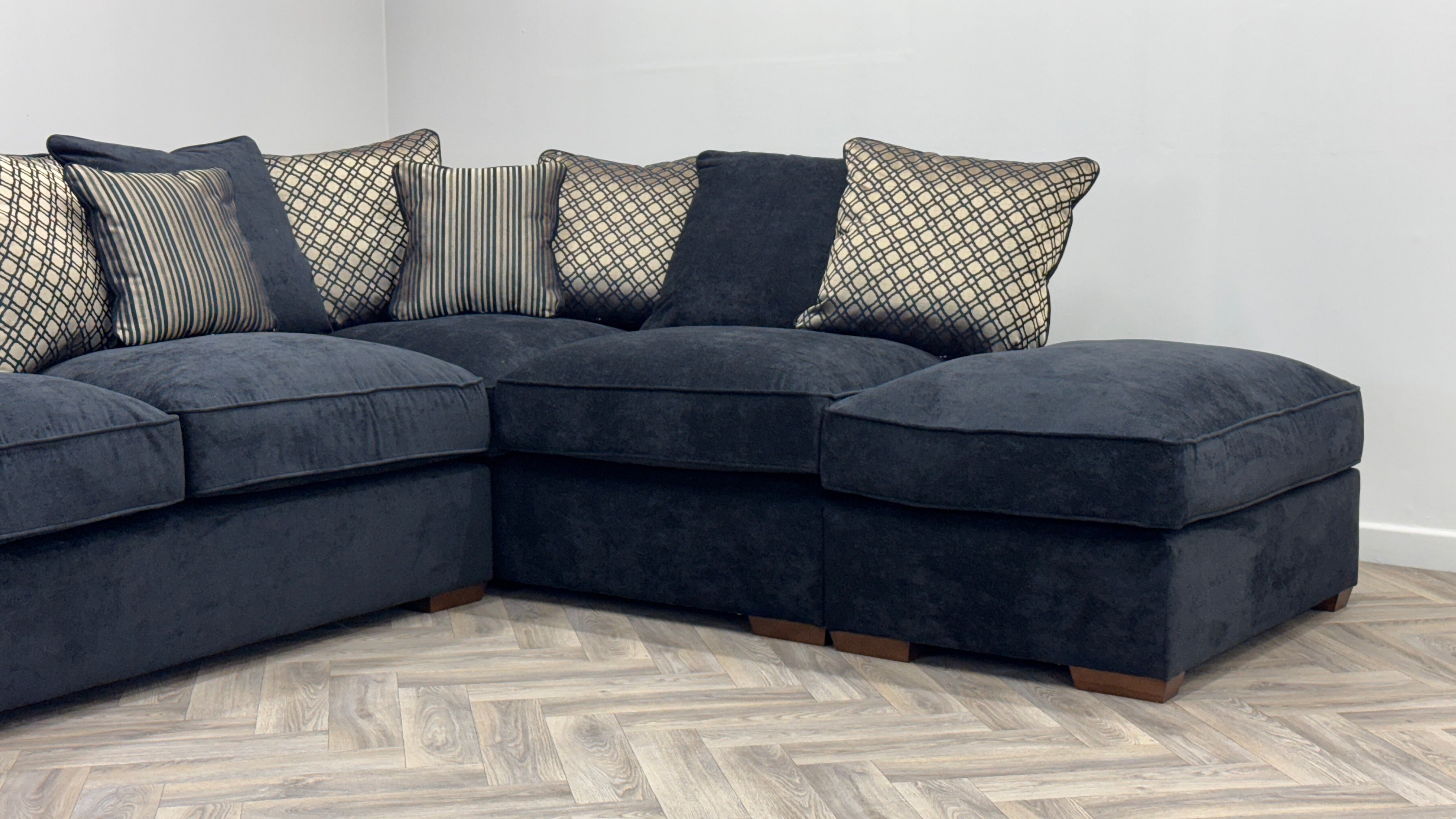 Fantasia Corner Sofa & Footstool Black Fabric Pillow Back