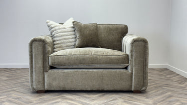 Roxy Night Loveseat fabric chair in gray with plush cushions and two decorative pillows on patterned wood floor.