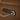 Close-up of reclining buttons and USB charging port embedded in tan leather armchair side panel