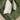Close-up of a green Penny 2 Corner 1 Fabric Sofa with two decorative pillows in a modern living room setting