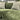 Close-up of green Penny 2 Corner 1 Fabric Sofa with textured upholstery and striped accent pillows in modern living room