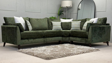 Green fabric Penny 2 corner sofa with multiple striped and plain cushions in a modern living room setting