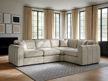 Beige Roxy Night 3 corner fabric sofa in a bright living room with large windows and beige curtains