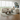 Modern Roxy Night 3 corner sofa in beige fabric with plush cushions and a woman relaxing in a bright living room.