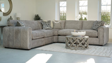 Roxy Night 3 corner terminal fabric sofa with 1.5 footstool in a bright modern living room setting