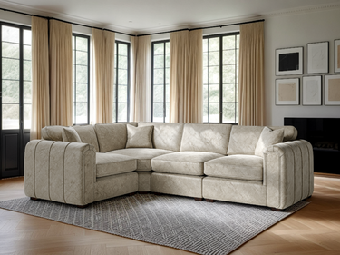 Roxy Night 1.5 corner fabric sofa in beige with plush cushions in a bright, modern living room setting