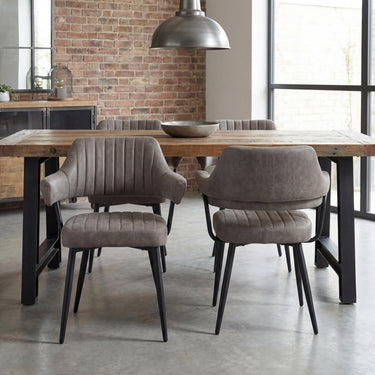 Cortez Leather Effect Dining Chair - Charcoal – styled in a dining room