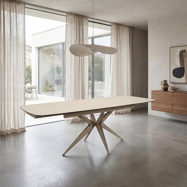 Nerano 2.4m Extending Natural Travertine Effect Dining Table – styled in a dining room