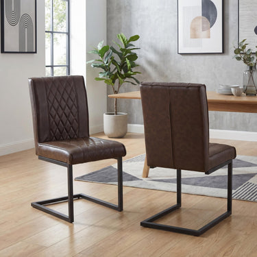 Wyatt Leather Effect Dining Chair - Brown – styled in a dining room